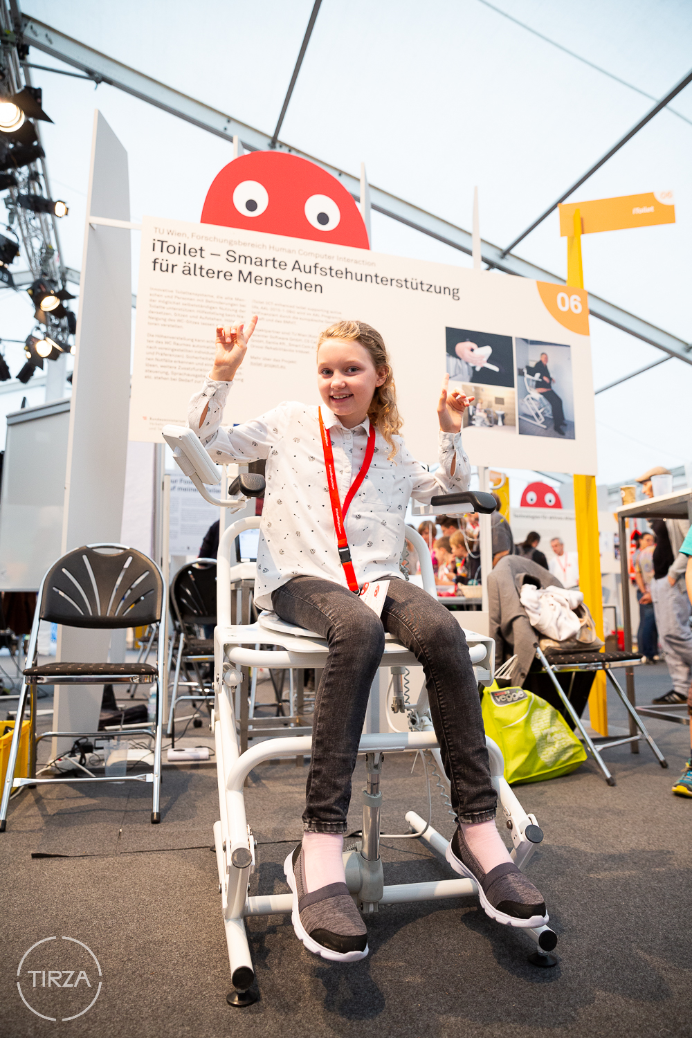 exhibition booth at the Wiener Forschungsfest showing stand up support prototype 1 and iToilet poster